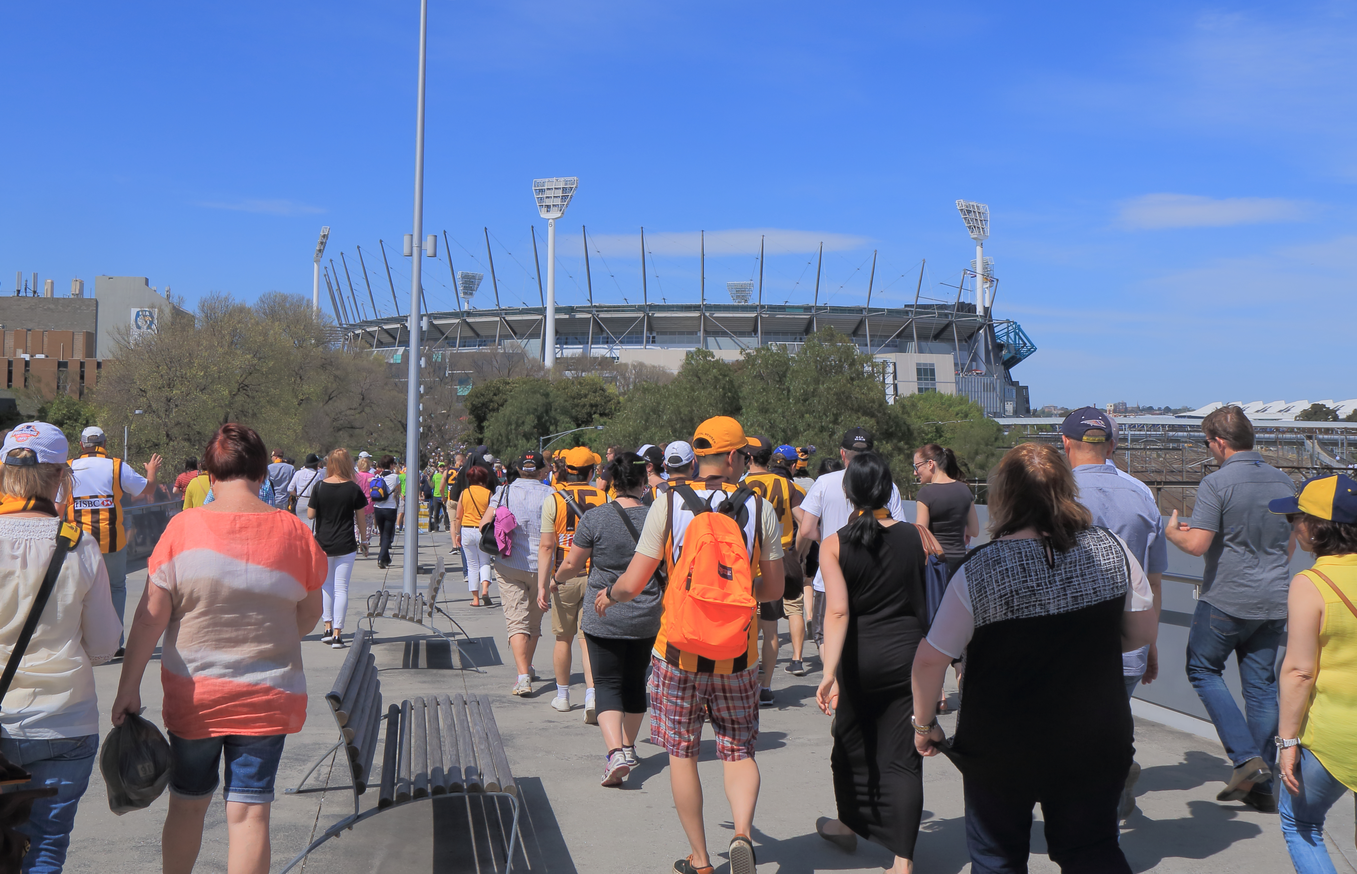 People visit the MCG for an AFL game. 